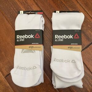 Two pair of white Rebook baseball socks
Men’s sizes 8-10